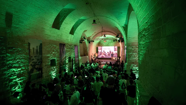 DigithON NEXT 2025 startup event in a historic stone venue in Bisceglie, Puglia